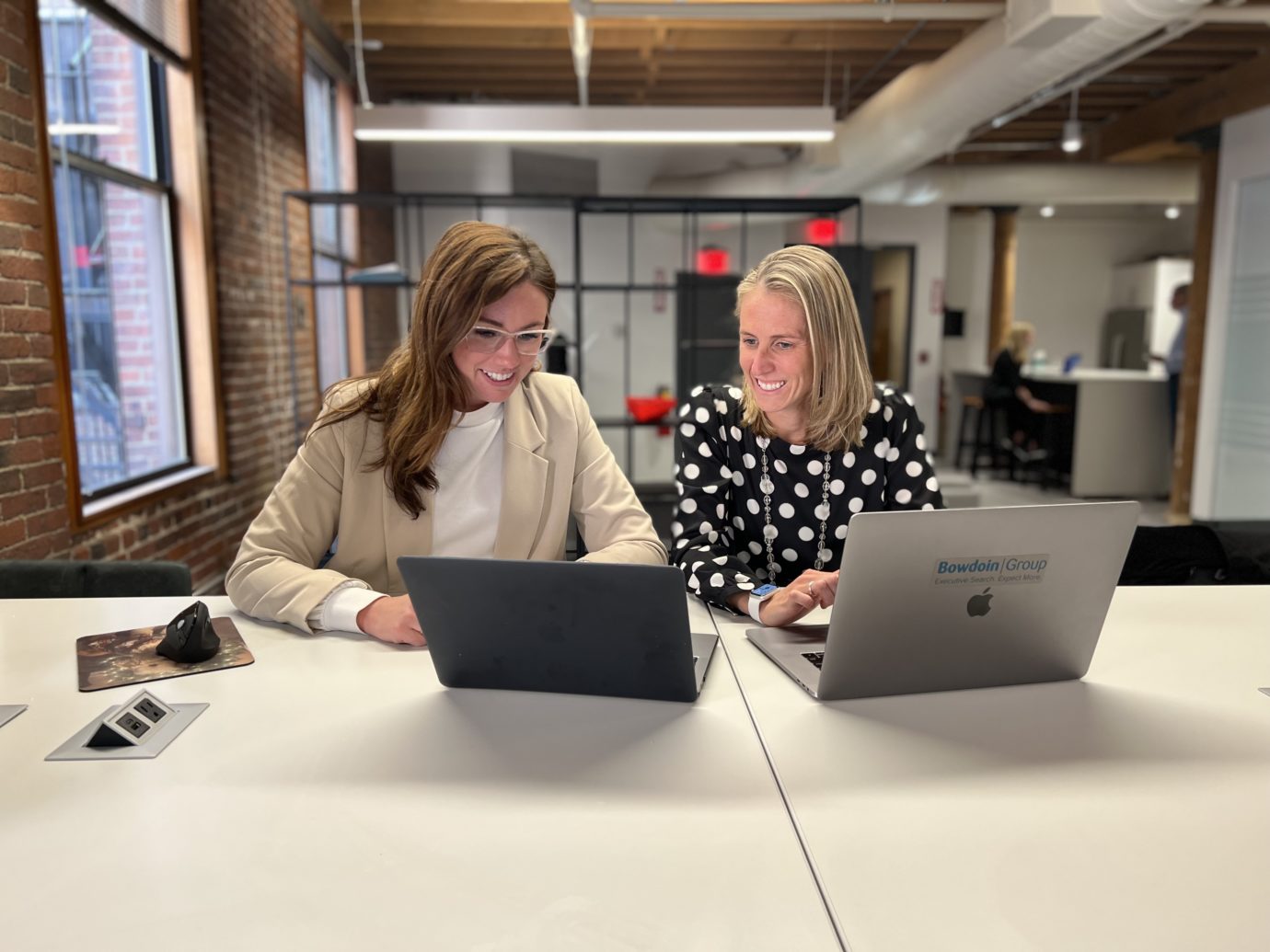 Two women at their laptops