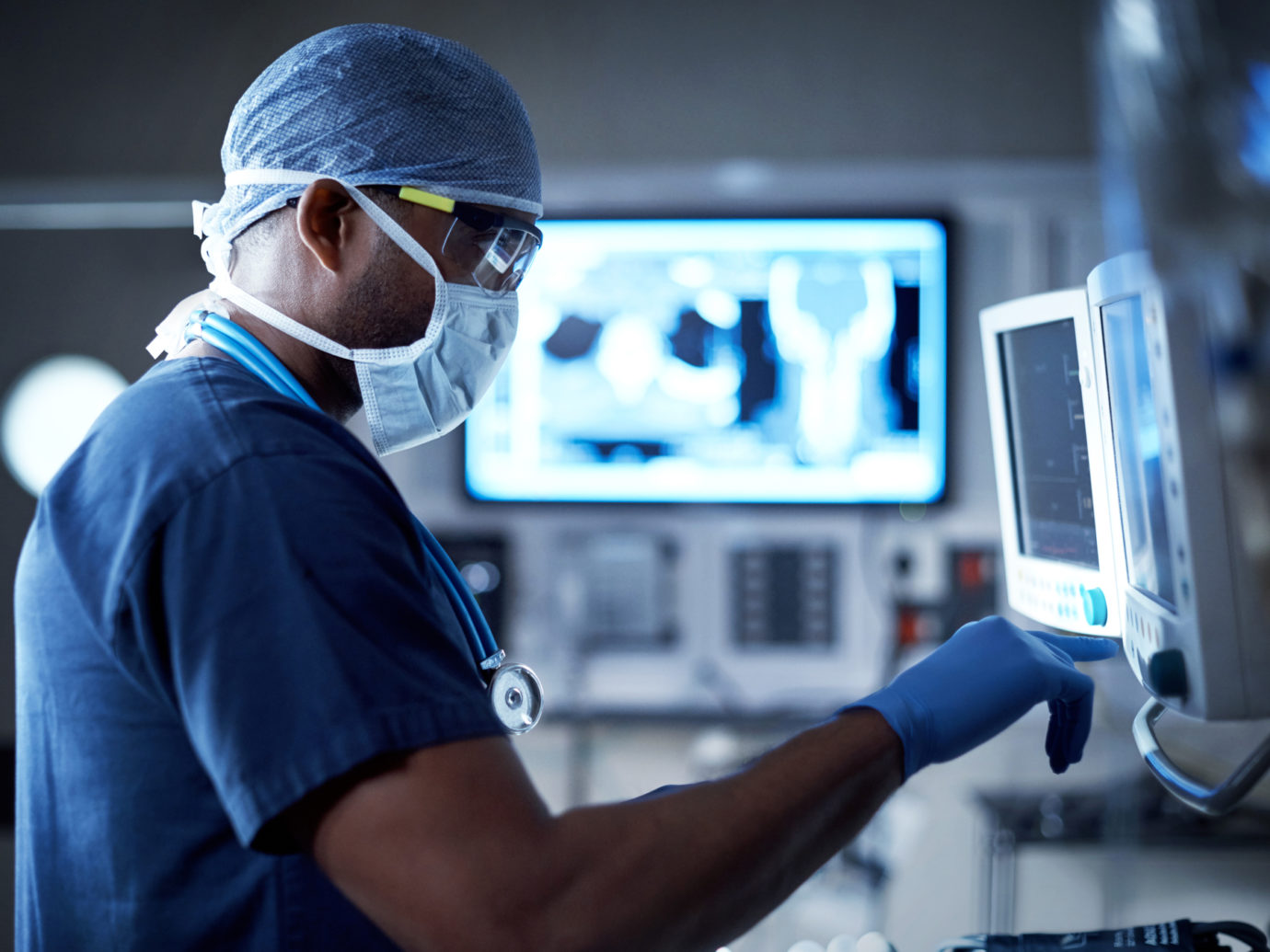 Surgeon looking at a monitor in an operating room