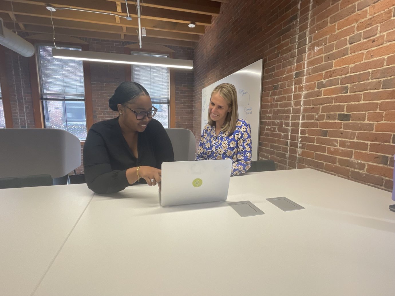 Two women working on a laptop on Recruitment Process Outsourcing